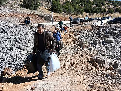 Lebanese escape Israeli bombardment by fleeing to Syria